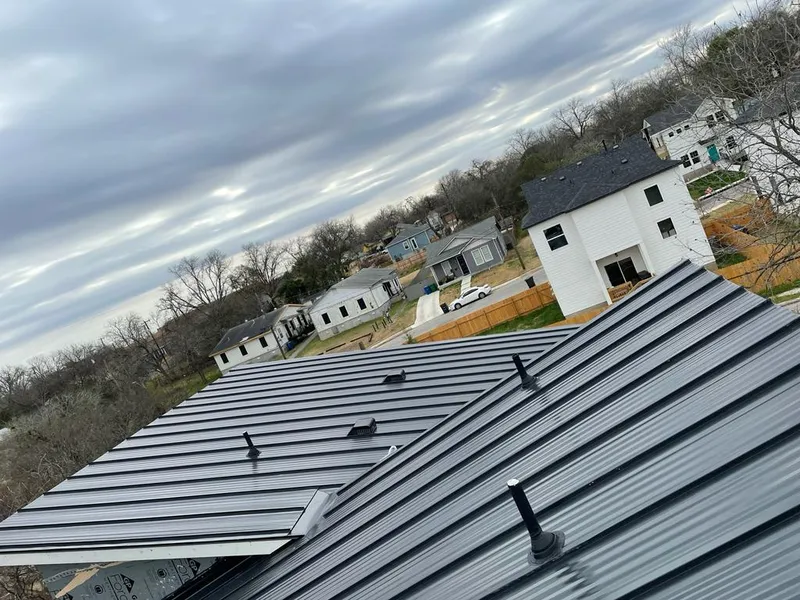 Standing seam metal roof panels with vents for Skylight Repair in Cedar Lake